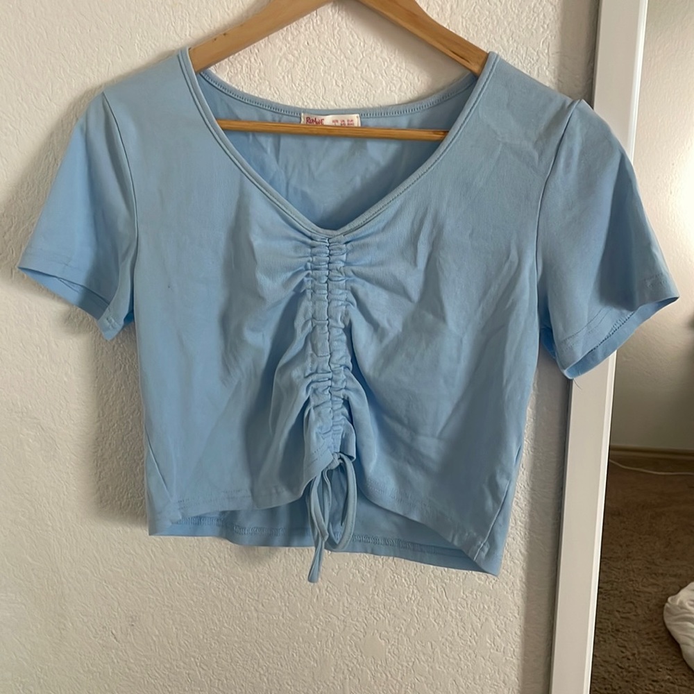 this is a sky blue crop top that fits well and looks nice